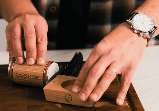 Hand holding the Oakstone oak roller and angle base