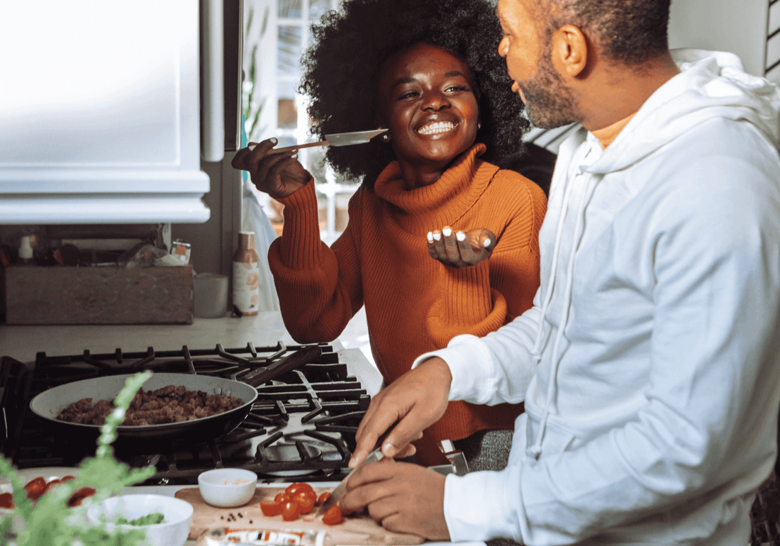 Couple cooking together in a home kitchen