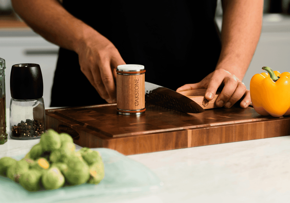 Knife on a wooden board beside the Oakstone roller