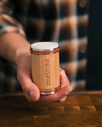 Hand holding the Oakstone oak roller with the white ceramic honing disc facing up